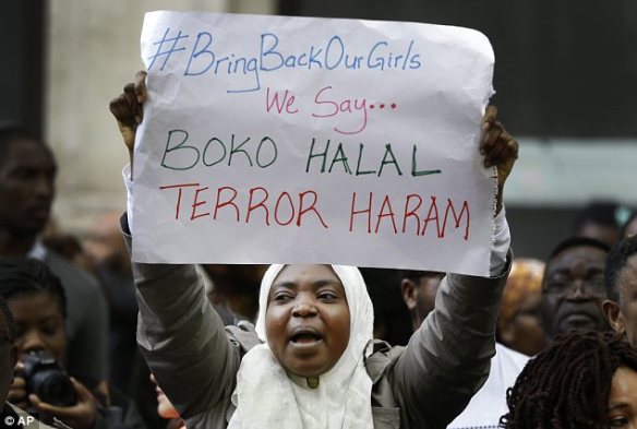 Global protests: Demonstrators yelled Friday in London, showing a play on words that reverses the meaning of Boko Haram -- 'Western education is permitted; Terror is sinful,' it reads. Photo: AP